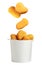 Fresh chicken nuggets falling into container on white background