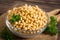 Fresh chickpeas in wooden bowl