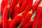 Fresh chili peppers on table, closeup