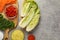 Fresh Chinese cabbages and other kimchi ingredients on light grey table, flat lay. Space for text