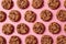 Fresh chocolate chip cookies pattern on pink background