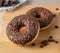 Fresh chocolate coffee donuts closeup