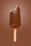 a fresh chocolate outer popsicle with a bite on brown background