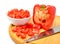 Fresh chopped bell pepper with a knife blade on cutting board