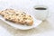 Fresh Christmas Stollen on a white plate with Coffee