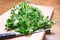 Fresh cilantro or coriander herb on chopping board