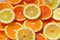 Fresh citrus sliced fruits top view solar background
