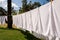 Fresh clean white towels drying on washing line