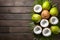 Fresh coconuts arranged tastefully on a wooden backdrop