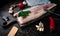 Fresh codfish fillet on a wooden cutting board.