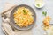 Fresh coleslaw salad from shredded cabbage and carrot on white background.