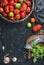 Fresh colorful ripe heirloom tomatoes in basket, copy space