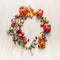 Fresh colorful tomatoes on branches with leaves, lined circle on a wooden background, top view