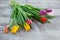 Fresh colorful tulip flowers bouquet on wooden table