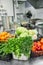 Fresh colorful Vegetables and fruit in kitchen on silver steel table. Work surface and kitchen equipment in professional