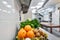 Fresh colorful Vegetables and fruit in kitchen on silver steel table. Work surface and kitchen equipment in professional