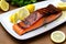 Fresh cooked delicious salmon steak with salad lemon potato