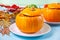 Fresh cooked pumpkin soup served in a pumpkin. Autumn warm and cozy food