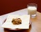 Fresh cookie served with a glass of milk