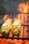 Fresh corncob on grill with salt and butter in summer