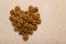 Fresh cracked walnut seeds arranged in heart shape