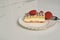 Fresh cream slice cake with strawberries on white marble with space