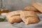 Fresh crispy ciabatta on grey table, closeup