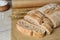 Fresh crispy ciabatta on white wooden table, closeup