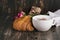 Fresh croissant and cappuccino over wooden table