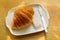 Fresh Croissant on the wood table with butter, Delicious Morning Meal