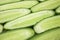 Fresh cucumber, chopped cucumber, isolated on wooden board