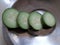 Fresh cucumber cuttings in steel dish. Taaja kapde