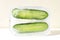 Fresh cucumber in ice with air bubbles. Frozen food trend. Preservation of summer vitamins. Concept of shock freezing of vegetable