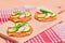 Fresh Cucumber and Radish with Green Onions and Cheese on Crispy Cracker