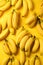 Fresh Cucumbers and Peeled Bananas on Yellow Background AI Generated