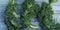 Fresh curly kale leaves on wooden table