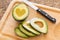 Fresh Cut Avocado With Heart Shaped Pit Area On Wooden Cutting Board