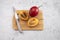 Fresh Cut Exotic Fruit Tamarillo On Wooded Cutting Board With Knife. Egg-shaped Edible