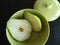 Fresh cut pear in grape green retro bowl with lid