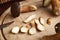 Fresh cut up pine bolete mushrooms on a wooden table