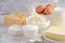 Fresh dairy products. Milk, cheese, brie, Camembert, butter, yogurt, cottage cheese and eggs on wooden table.