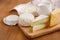 Fresh dairy products. Milk, cheese, brie, camembert and cottage cheese on the wooden background.