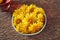 Fresh dandelion flowers in a bowl - herbal medicine