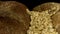 Fresh delicious bread isolated on black background. Stock footage. Close up of rustic rye loaf of bread with crispy