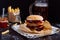 Fresh delicious burgers with french fries, sauce and beer on the wooden table