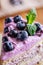 Fresh delicious piece of cake with blueberries and mint