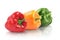 Fresh different bell peppers on background