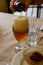 Fresh draught lager or IPA beer is glass served in indoor cafe close up, glass of beer