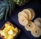 Fresh and dried pineapples, background.