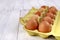 Fresh eggs in a cardboard form on a wooden table. Tasty eggs for baking bread in the bakery